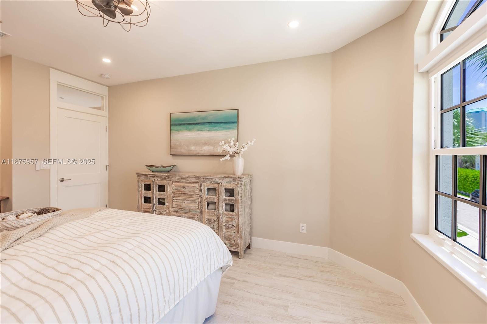 117 Ocean Key Way Jupiter, FL 33477 - Photo 36 of 58 a bedroom with a bed and a window
