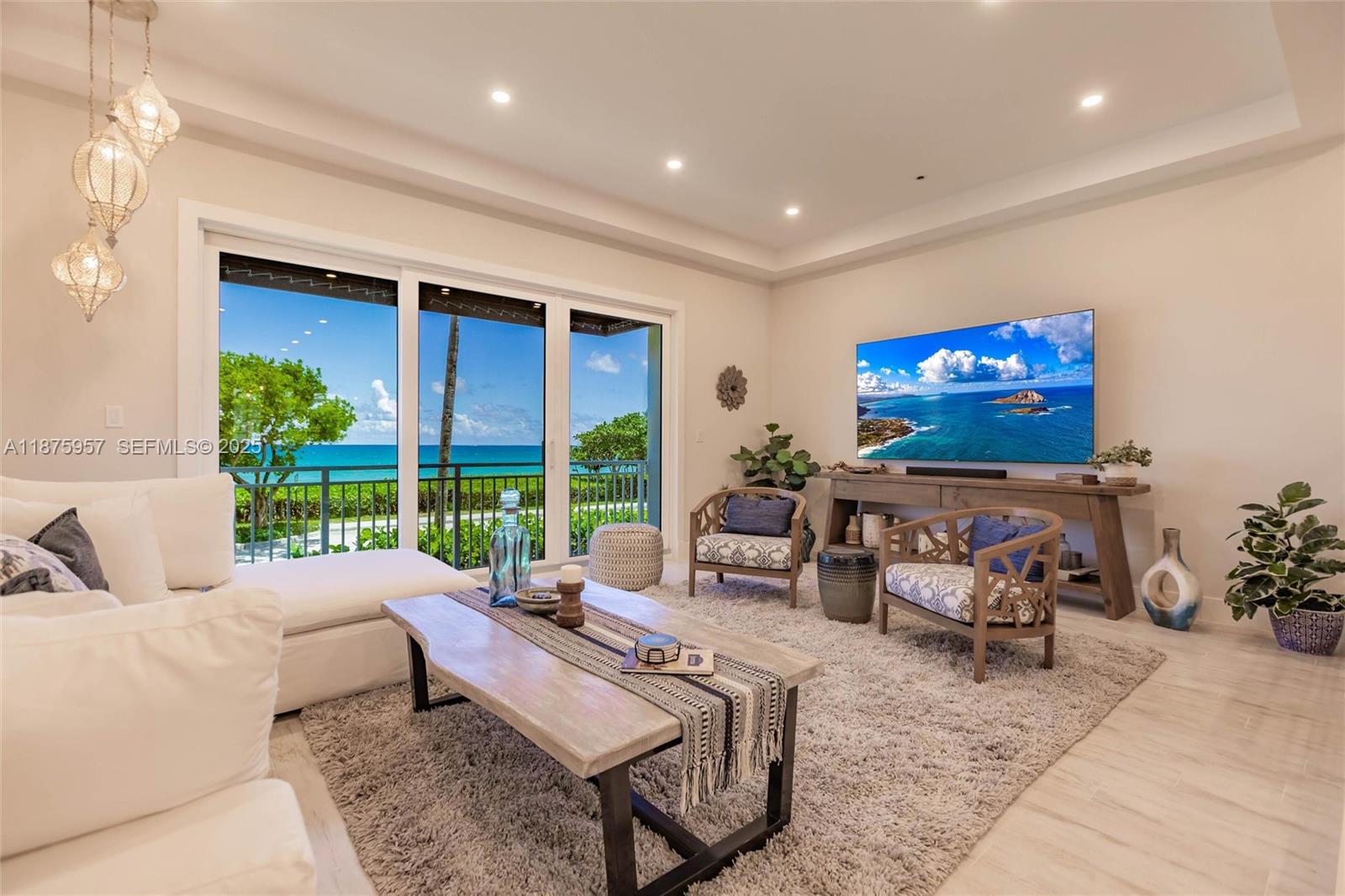 117 Ocean Key Way Jupiter, FL 33477 - Photo 39 of 58 a living room with furniture tv and a large window