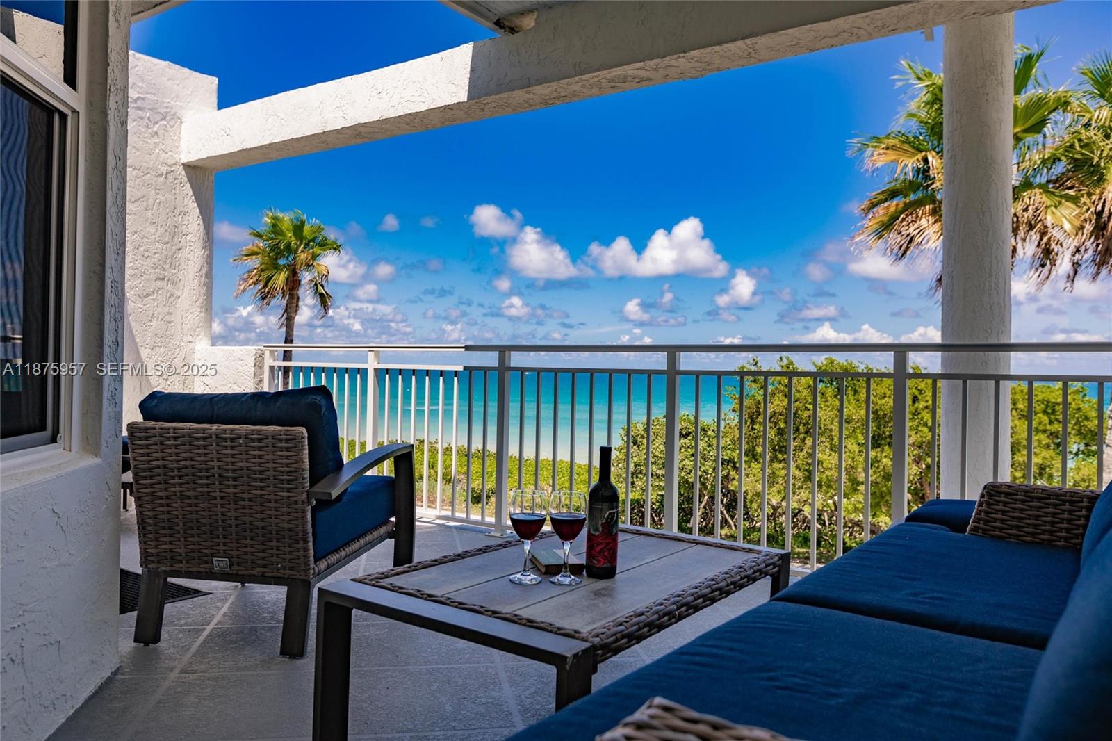 117 Ocean Key Way Jupiter, FL 33477 - Photo 4 of 58 a view of a balcony with two chairs and a table