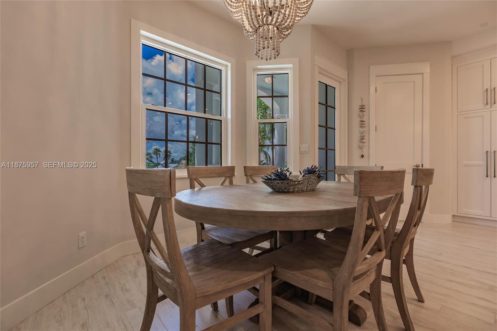 117 Ocean Key Way Jupiter, FL 33477 - Photo 47 of 58 a view of a dining room with furniture and window