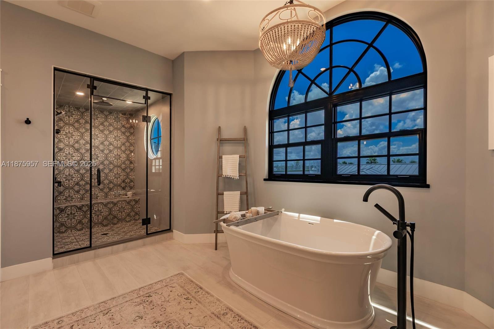 117 Ocean Key Way Jupiter, FL 33477 - Photo 53 of 58 a bathroom with a tub and a shower