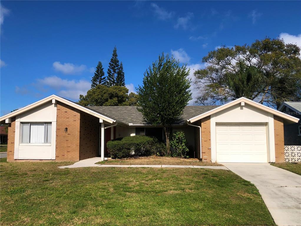 4503 Steamboat Court New Port Richey, FL 34652 - Photo 1 of 1 a front view of a house with a yard and garage