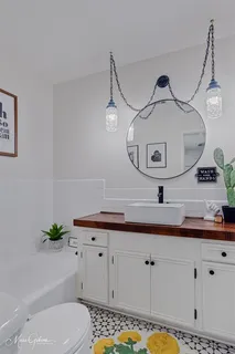 a bathroom with a sink and a shower