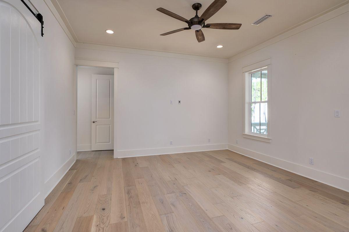 430 Redbud Ln Inlet Beach Inlet Beach, FL 32461 - Photo 32 of 50 a view of empty room with wooden floor and fan