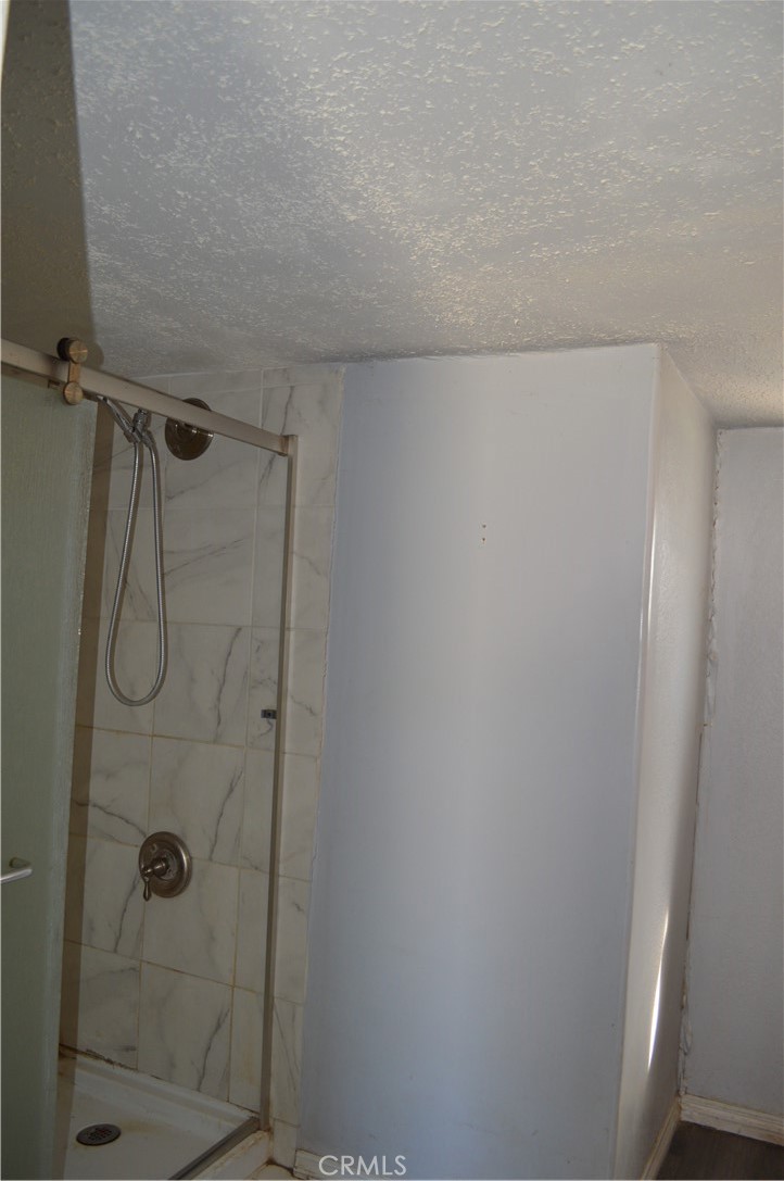 51901 Maxine Avenue Cabazon, CA 92230 - Photo 16 of 25 a bathroom with a shower