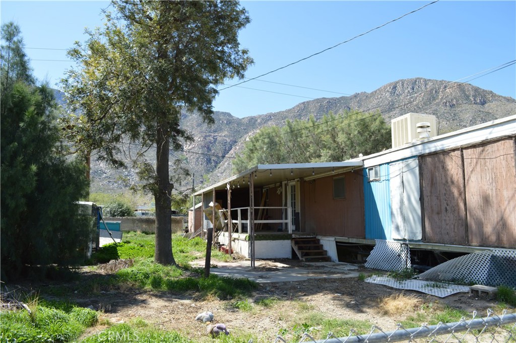 51901 Maxine Avenue Cabazon, CA 92230 - Photo 3 of 25 a view of a house with backyard