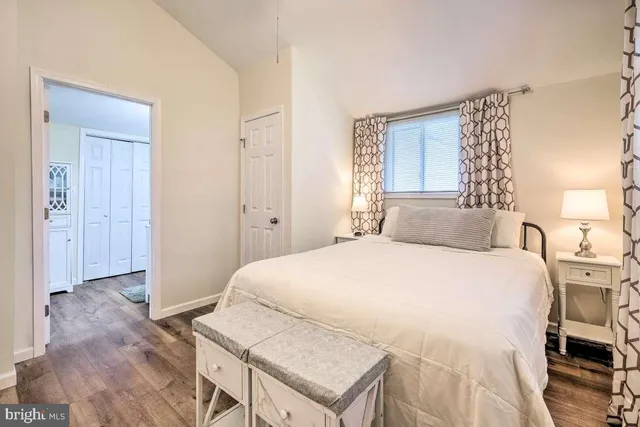 a bedroom with a bed and a table