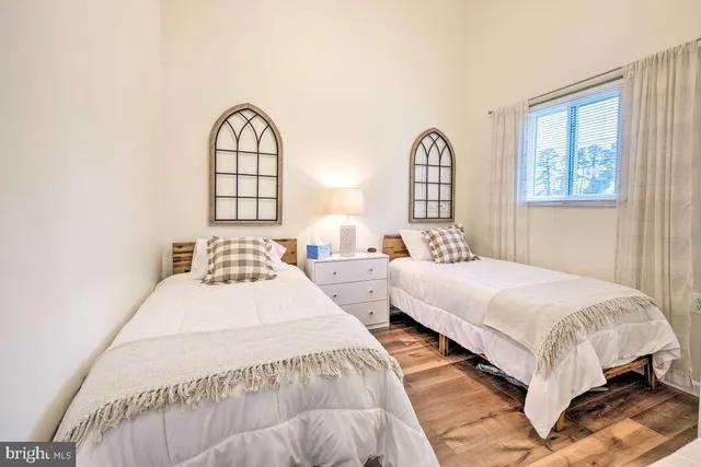 a bedroom with bed and a window