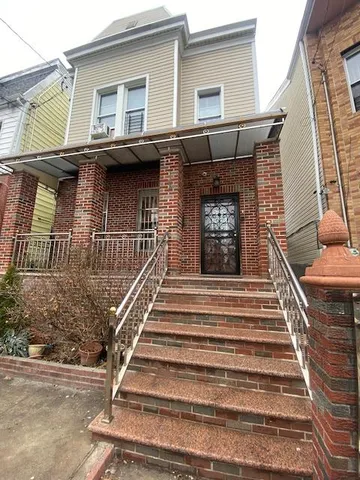 a brick building with a door and a window
