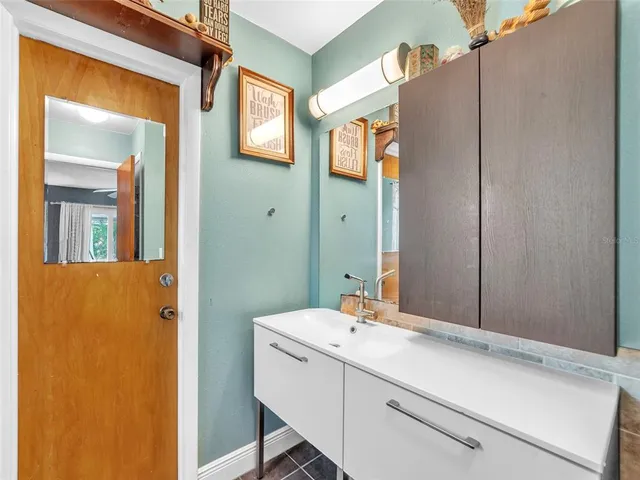 a bathroom with a sink and a mirror