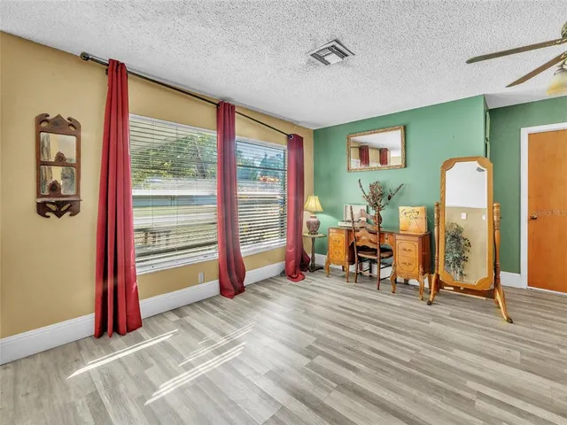 a view of a room with gym equipment and a large window