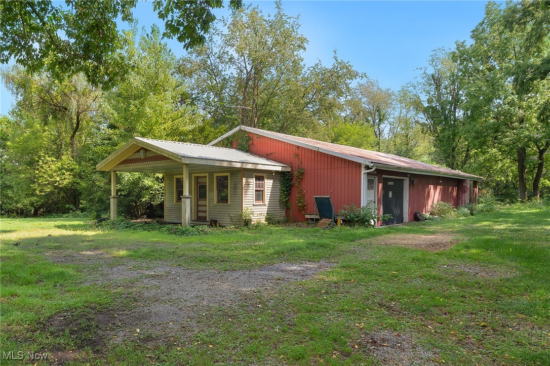 10158 Navarre Road Southwest Navarre, OH 44662 - Photo 2 of 14 View of property exterior featuring a yard