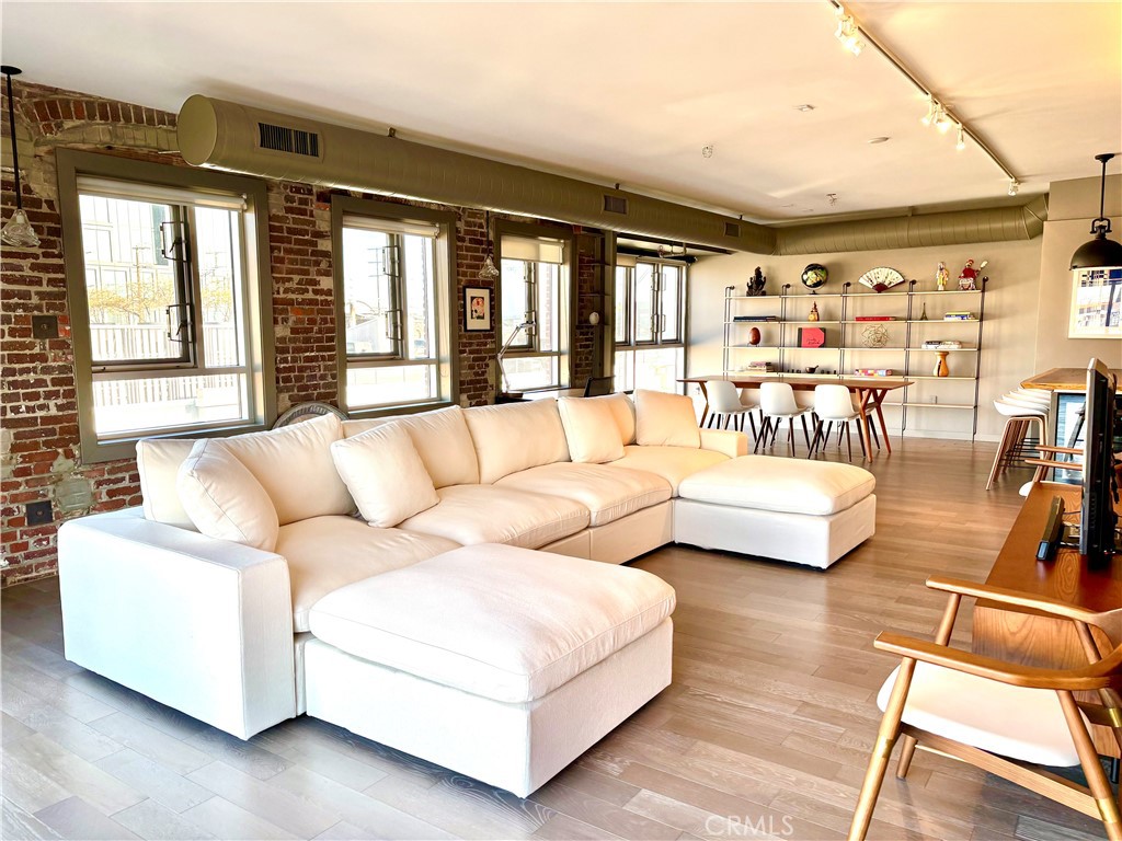 527 Molino Street, Unit 401 Los Angeles, CA 90013 - Photo 1 of 31 a living room with furniture and a large window