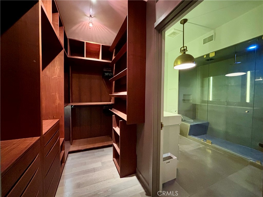 527 Molino Street, Unit 401 Los Angeles, CA 90013 - Photo 13 of 31 a view of walk in closet and bathroom