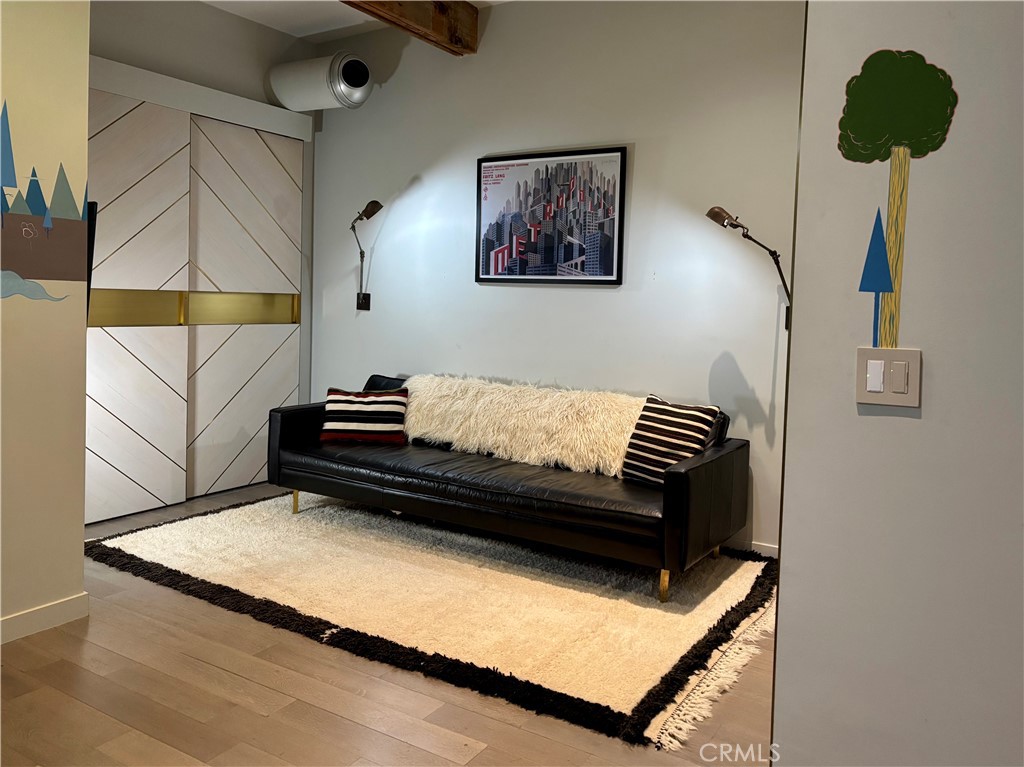 527 Molino Street, Unit 401 Los Angeles, CA 90013 - Photo 17 of 31 a living room with a couch