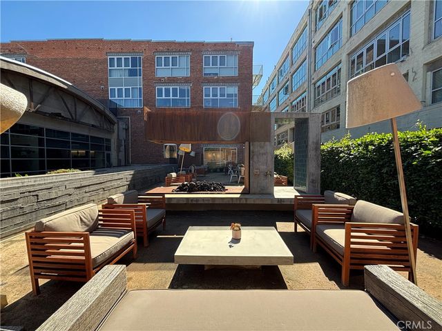 a swimming pool view with a seating space