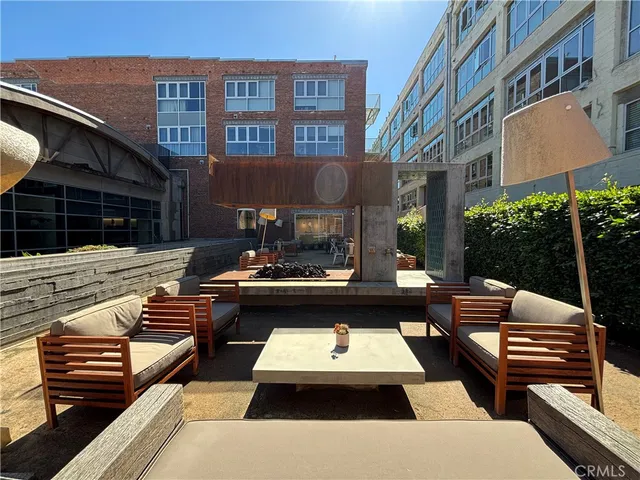 a swimming pool view with a seating space