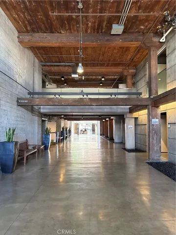 a view of a studio with wooden floor