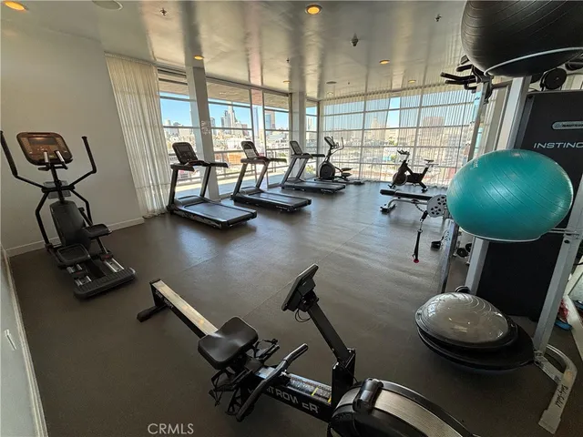a room with gym equipment and a window