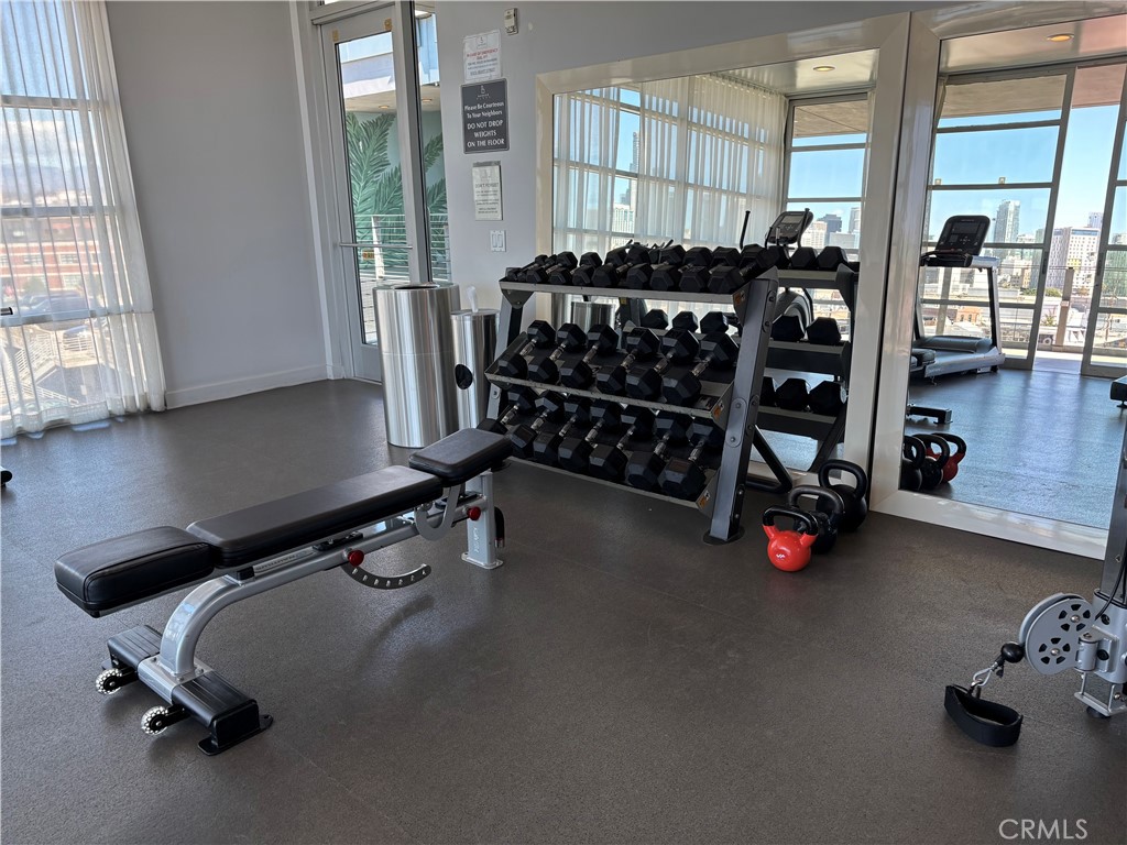 527 Molino Street, Unit 401 Los Angeles, CA 90013 - Photo 31 of 31 a room with gym equipment and a window