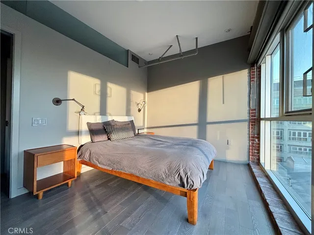 a bedroom with bed and window