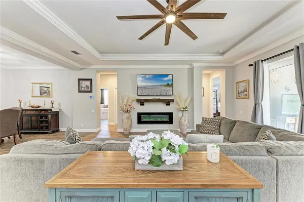 a kitchen with kitchen island a counter top space a sink stainless steel appliances and cabinets