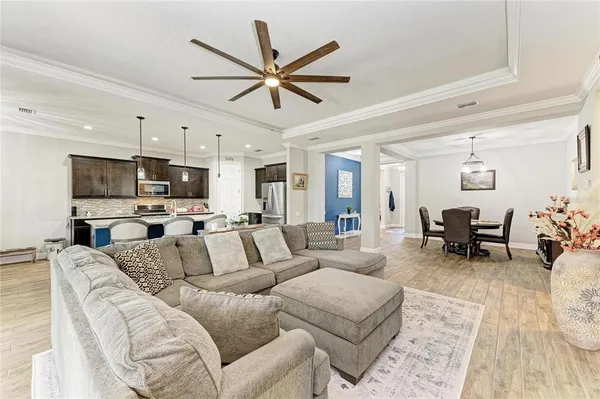 a large kitchen with kitchen island granite countertop a stove oven and a sink with granite countertops