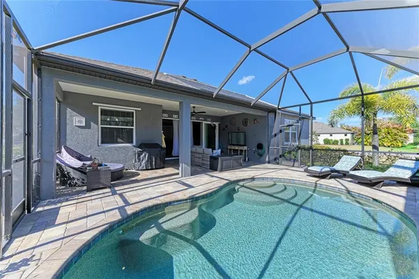 a view of an outdoor space yard swimming pool and outdoor seating