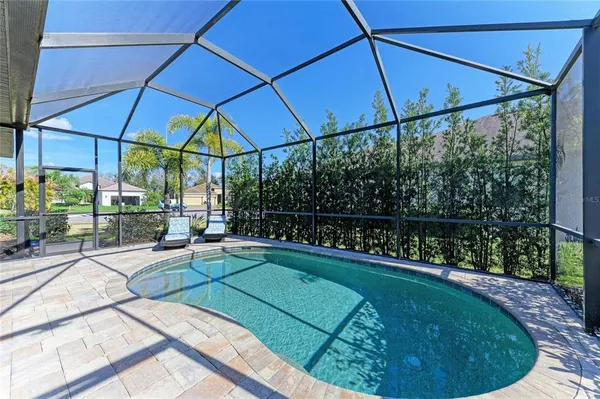 an aerial view of a swimming pool and outdoor space
