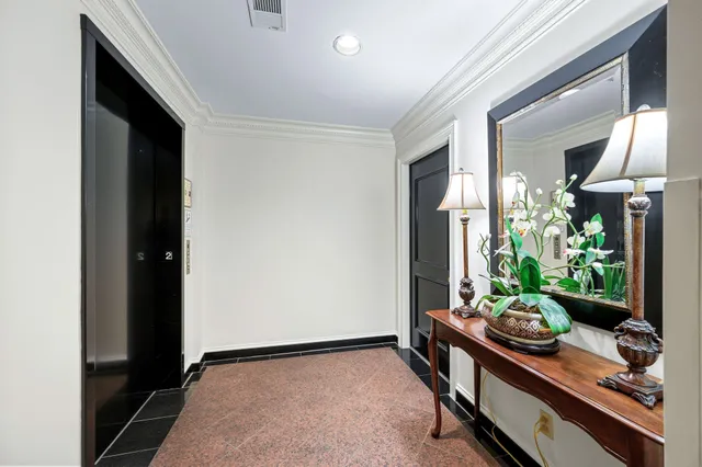 a view of a dining room with furniture wooden floor and chandelier