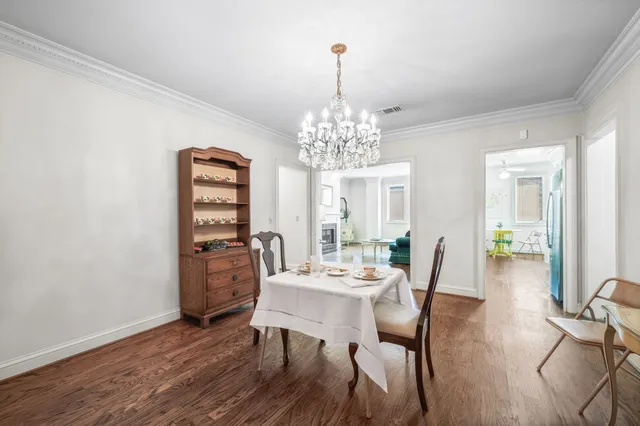 a living room with furniture a fireplace and a table