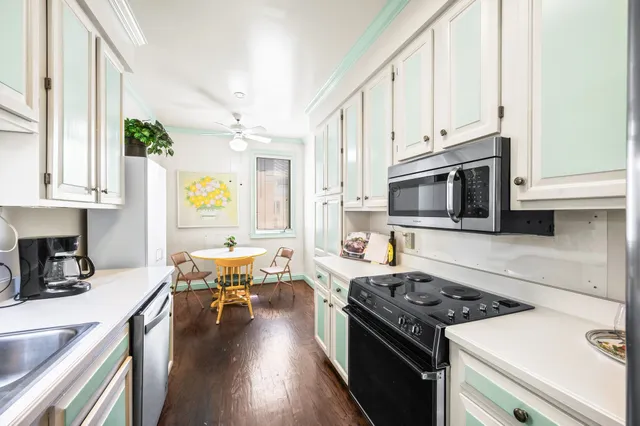 a kitchen with stainless steel appliances granite countertop a stove and a sink