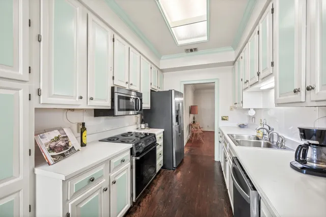 a bedroom with a bed and a lamp