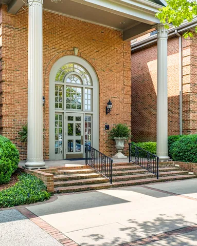 a bedroom with furniture and window