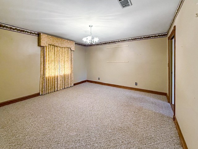 412 Neal Street Jasper, TX 75951 - Photo 3 of 22 an empty room with windows and painted walls