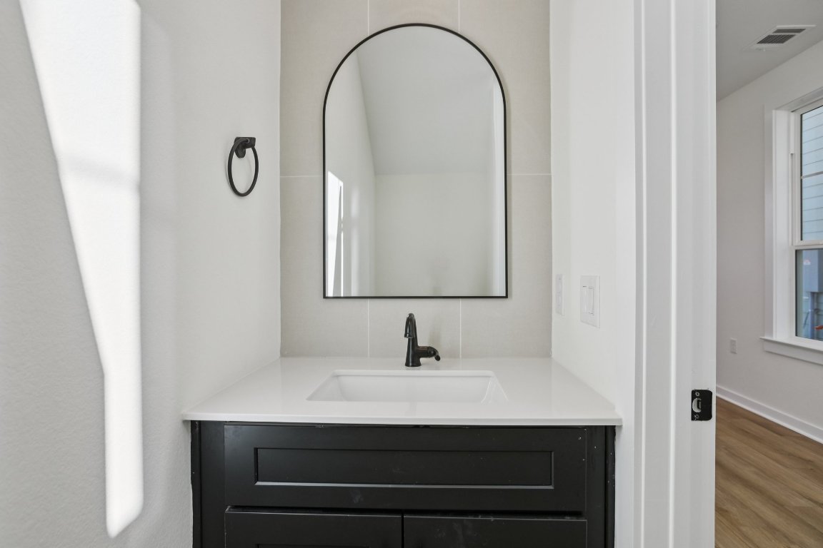 2414 Drew Lane, Unit 5 Austin, TX 78748 - Photo 15 of 33 a bathroom with a sink and a mirror