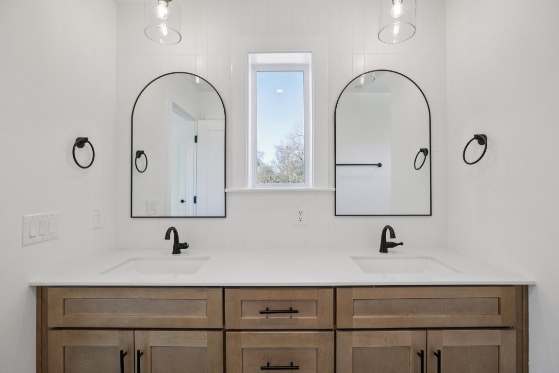 2414 Drew Lane, Unit 5 Austin, TX 78748 - Photo 26 of 33 a bathroom with a sink and mirror