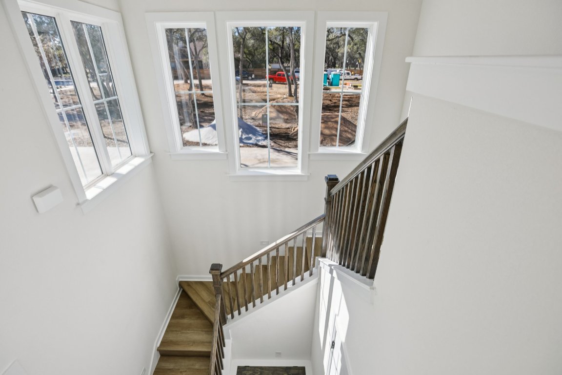 2414 Drew Lane, Unit 5 Austin, TX 78748 - Photo 5 of 33 a view of staircase with railing and white walls