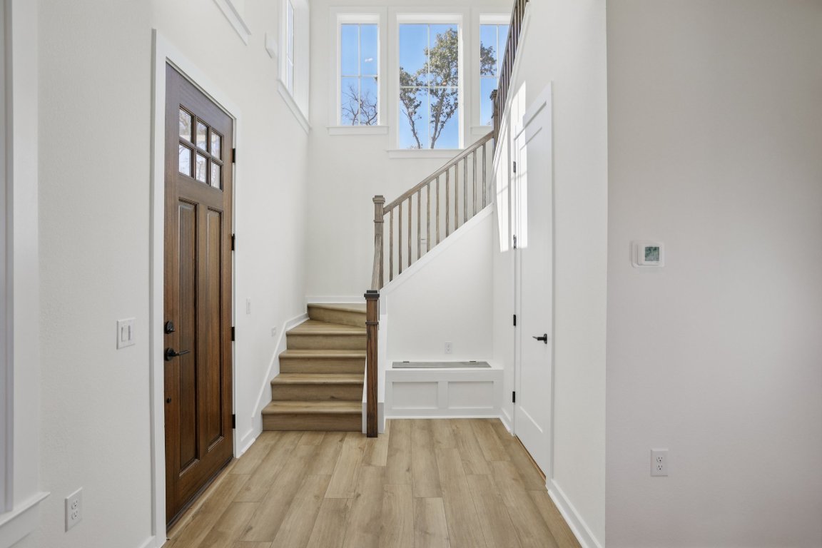 2414 Drew Lane, Unit 5 Austin, TX 78748 - Photo 6 of 33 a view of entryway with wooden floor and stairs
