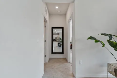 a spacious bedroom with a bed and a window