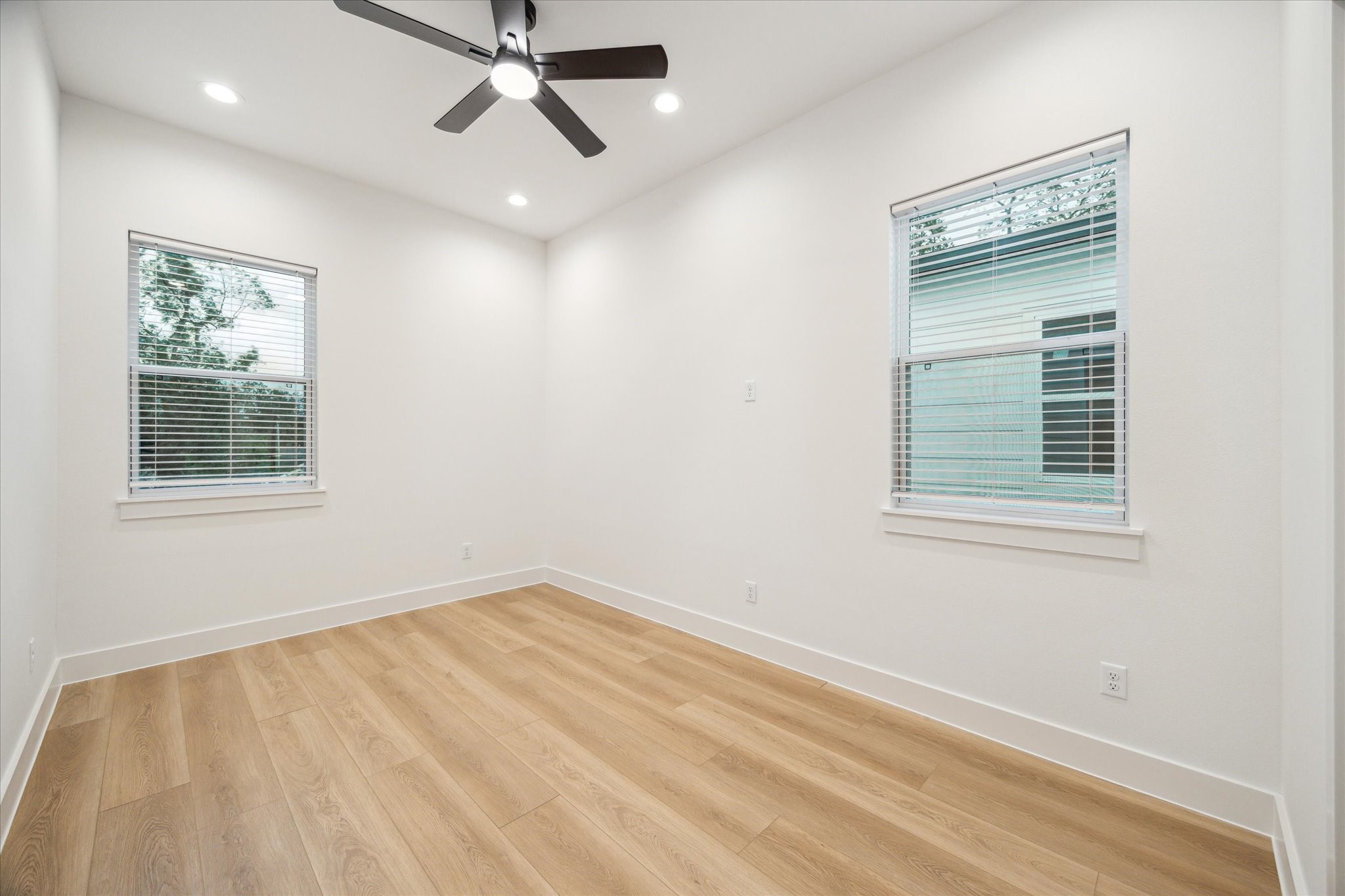 3506 Delhi Street, Unit A Houston, TX 77022 - Photo 11 of 15 a view of empty room with windows and fan