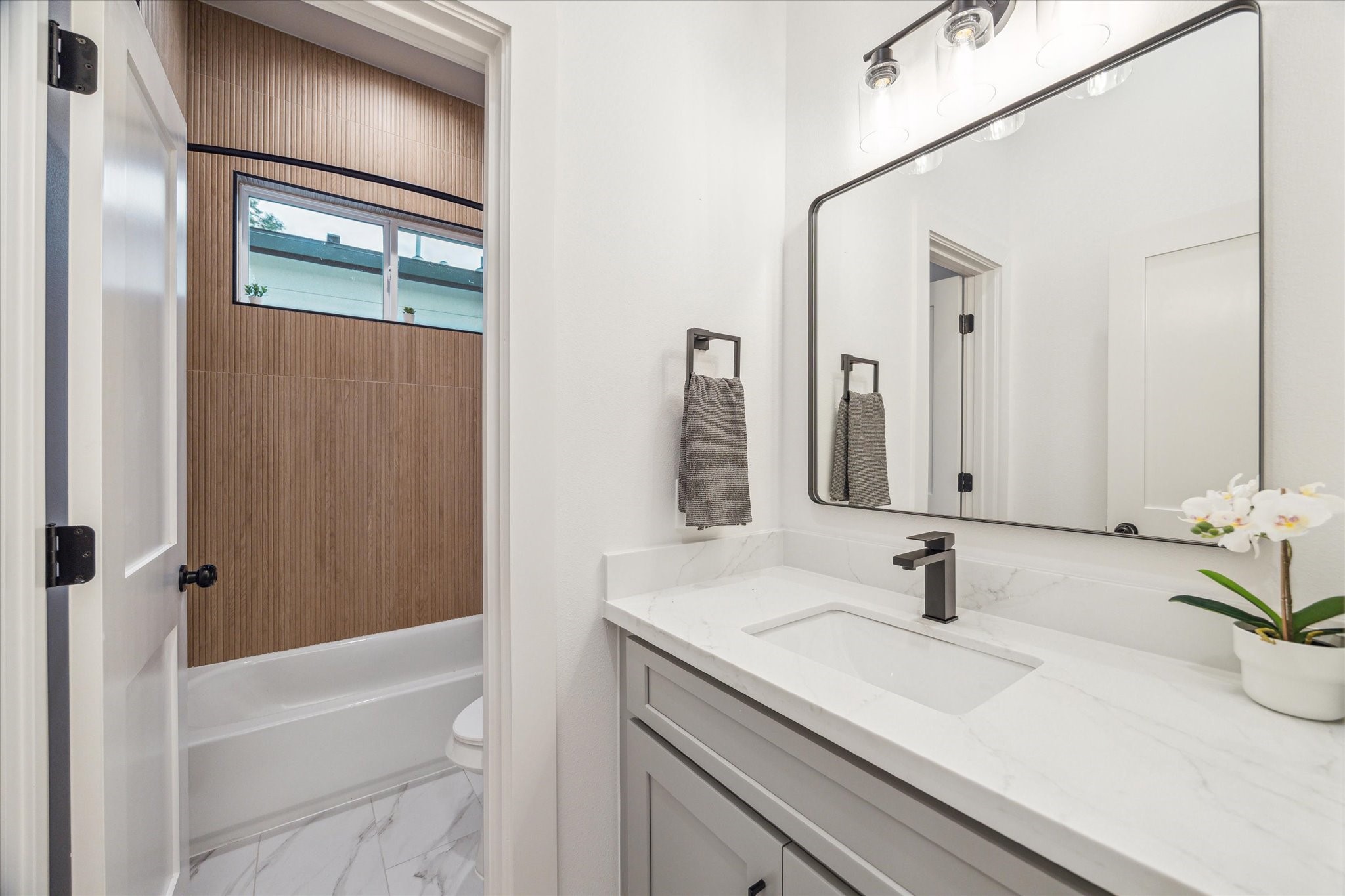 3506 Delhi Street, Unit A Houston, TX 77022 - Photo 12 of 15 a bathroom with a sink and a mirror