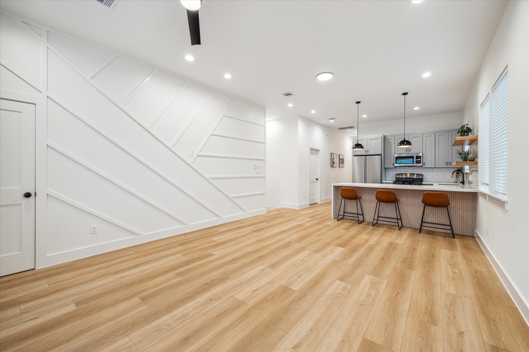 3506 Delhi Street, Unit A Houston, TX 77022 - Photo 5 of 15 a kitchen with stainless steel appliances kitchen island granite countertop a sink and cabinets