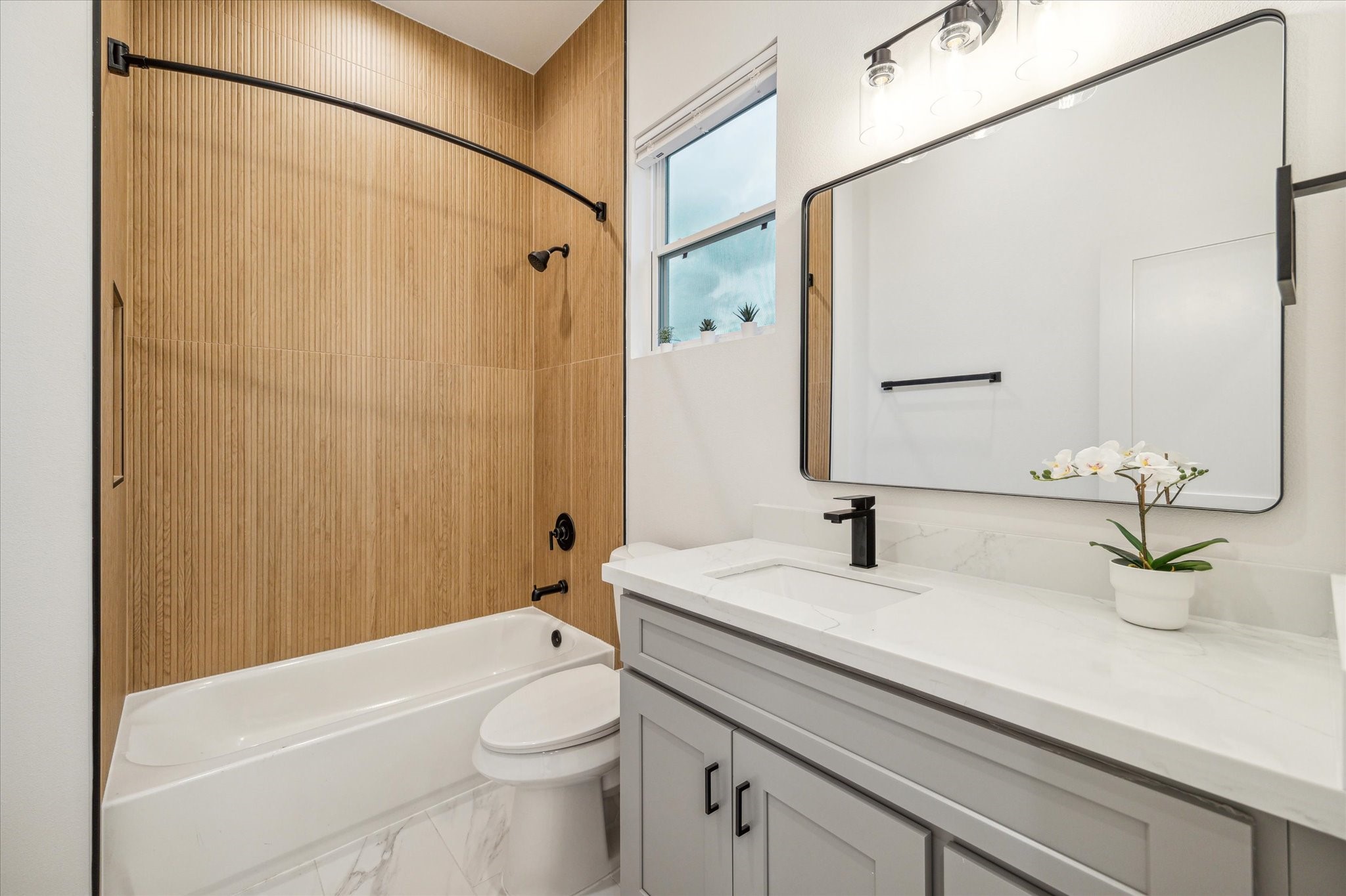 3506 Delhi Street, Unit A Houston, TX 77022 - Photo 10 of 15 a bathroom with a sink a toilet and shower