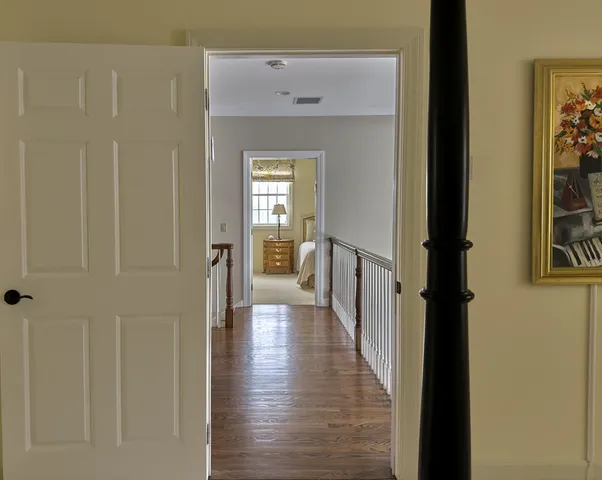 a view of hall way with furniture