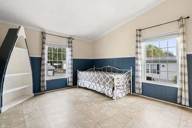 a room with a bed and a window