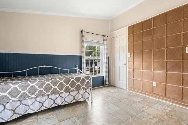 a bathroom with a sink a toilet and a window