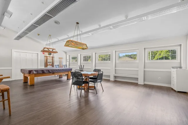 a view of empty room with lots of wooden floor