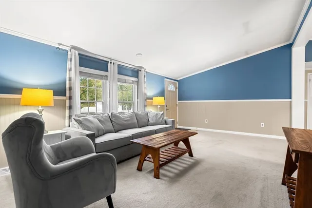 a living room with furniture and a table