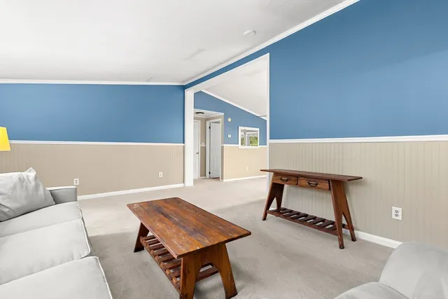 a living room with a couch and a table